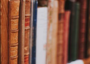 A close-up of books on the shelf in the library of St. Charles Retreat Centre.
