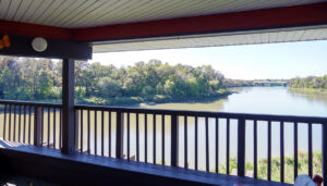Scenic river view from the balcony at St. Charles Retreat Centre, surrounded by lush greenery and tranquil waters.